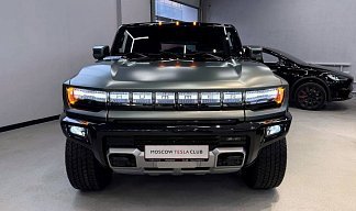 GMC Hummer SUV EV зеленого цвета 2024 года на 22 колёсах фото 5
